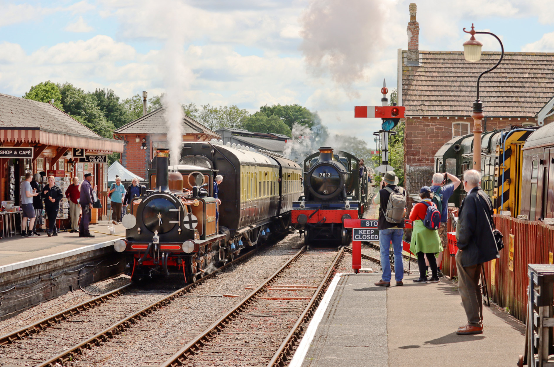 Fenchurch waits as Manor no.7812 'Erlestoke Manor' & Saint no.2999 'Lady of Legend' (as no.2986 'Robin Hood') arrive at Bishops Lydeard, Somerset, England with a train for Minehead from Norton Fitzwarren during the Spring Steam Spectacular Gala at the West Somerset Railway 4 May 2025 - Ashley Smith