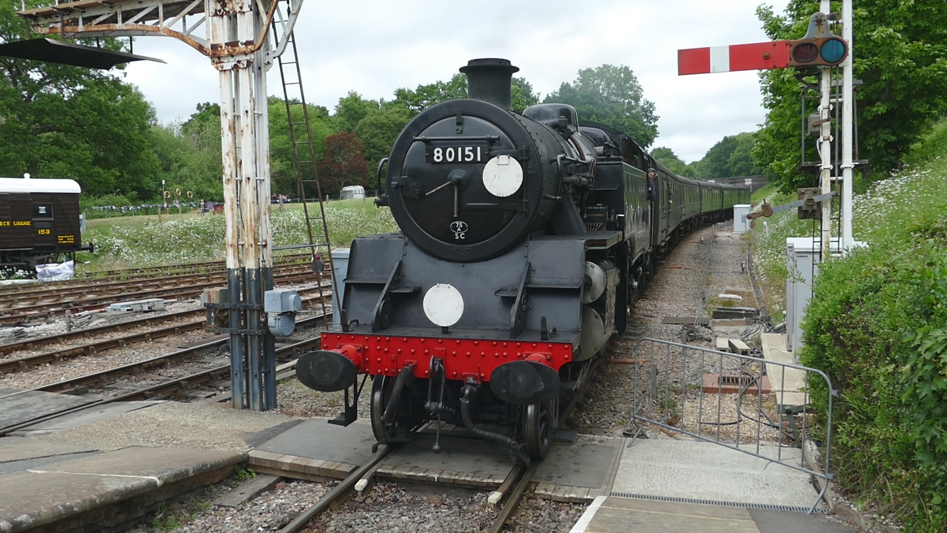 80151 brings its train into Horsted Keynes - John Sandys - 30 May 2025